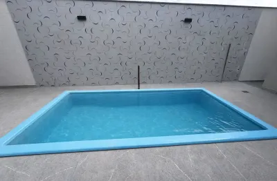 Casa com piscina área gourmet lavabo suíte quartos sala de estar e jantar garagem para 2 carros