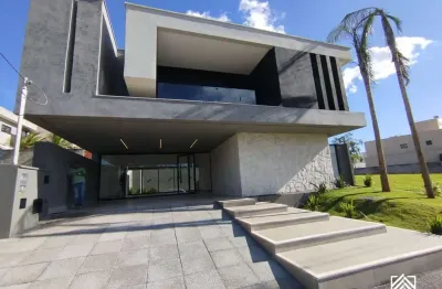 Casa à venda no jardins capri - 4 suítes, frente para mata e piscina