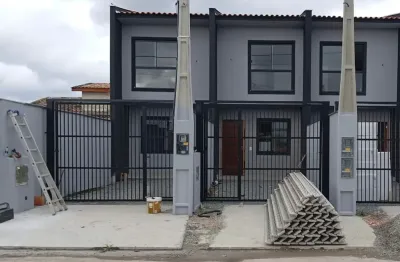 Linda casa geminada no centro de araquari, pronto para morar!