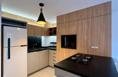 Apartamento mobiliado com 47m2, 1 dorm. suíte, churrasqueira, garagem.