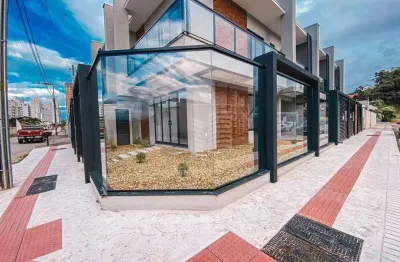 Sobrado com 3 dormitórios à venda, 104 m² por R$ 690.000 - Itacolomi - Balneário Piçarras/SC