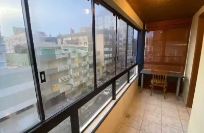 Apartamento 2 dormitórios amplo de frente com varanda no centro capão da canoa