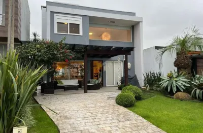 Sobrado mobiliado e decorado com piscina e 3 dormitórios em Xangri-lá