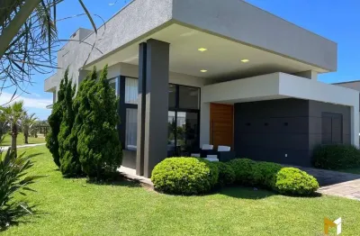 Casa mobiliada com fundos para área verde no condomínio Riviera em Xangri-lá RS