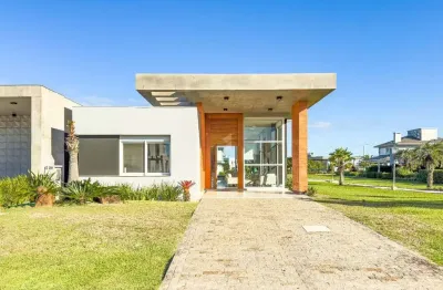 Casa mobiliada beira lago com piscina no condomínio Riviera em Xangri-lá RS