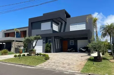 Sobrado beira lago com 6 suítes no condomínio Celebration em Xangri-lá RS