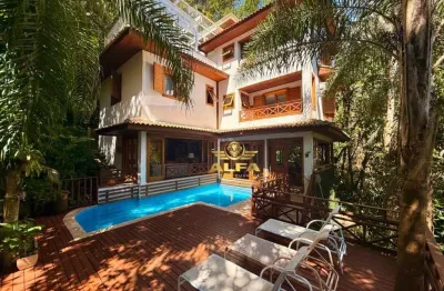 Casa de luxo à venda no condomínio iporanga, guarujá – 5 suítes, piscina, gourmet e natureza exclusiva | alfa imóveis guarujá