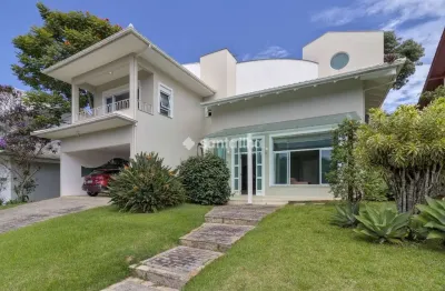 Casa em condomínio fechado com 4 quartos à venda na estrada haroldo soares glavan, 2064, cacupé, florianópolis por r$ 3.800.000