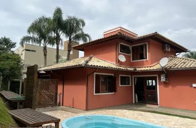 Casa em condomínio fechado com 4 quartos à venda na Rodovia Doutor Antônio Luiz Moura Gonzaga, 383, Rio Tavares, Florianópolis por R$ 2.950.000