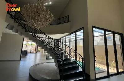 Luxuosa casa em condomínio com 6 quartos e 4 suítes em Jardinópolis-SP, no Condomínio Vila Nova Jerusalém. 842,07 m² de conforto e sofisticação. Quer Imóvel Negócios Imobiliários!
