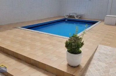 Sobrado de condomínio, 200 mts da praia c/ piscina - 277 mil