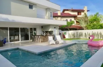 Casa com 5 quartos à venda na avenida dos búzios, 1931, jurerê internacional, florianópolis, 385 m2 por r$ 7.200.000