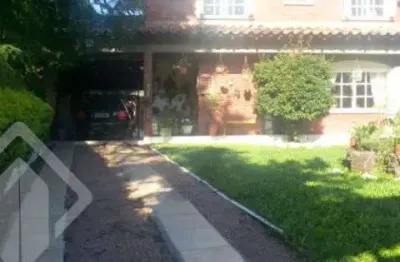 Casa em condomínio fechado com 3 quartos à venda na rua dos guenoas, 796, guarujá, porto alegre, 300 m2 por r$ 1.080.000