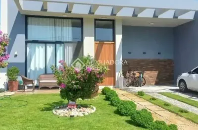 Casa em condomínio fechado com 4 quartos à venda na honorio germano, 2009, condomínio dubai resort, capão da canoa, 201 m2 por r$ 2.150.000