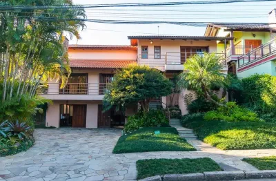 Casa em condomínio fechado com 5 quartos à venda na avenida firmino octávio bimbi, 255, cavalhada, porto alegre, 420 m2 por r$ 2.480.000