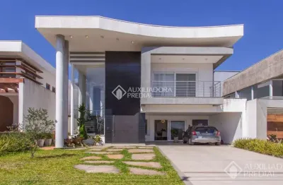 Casa em condomínio fechado com 4 quartos à venda na Tapir Rocha, 8500, São Lucas, Viamão, 284 m2 por R$ 1.970.000