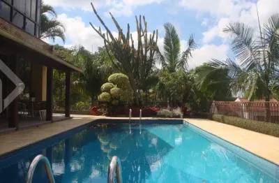 Casa em condomínio fechado com 3 quartos à venda na rua dos guenoas, 501, guarujá, porto alegre, 667 m2 por r$ 1.700.000