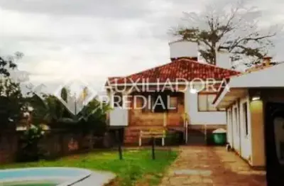 Casa em condomínio fechado com 3 quartos à venda na rua marquês do maricá, 168, vila nova, porto alegre, 605 m2 por r$ 750.000