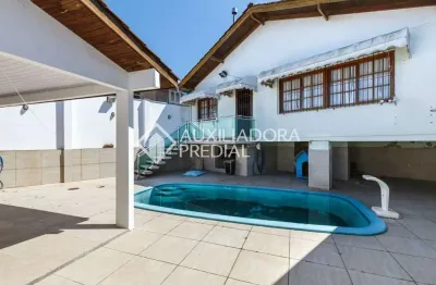 Casa com 4 quartos à venda na avenida edu las casas, 565, parque santa fé, porto alegre, 237 m2 por r$ 649.000