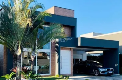 Casa em condomínio fechado com 5 quartos à venda na rua rio novo, 2672, centro, xangri-lá, 330 m2 por r$ 2.490.000