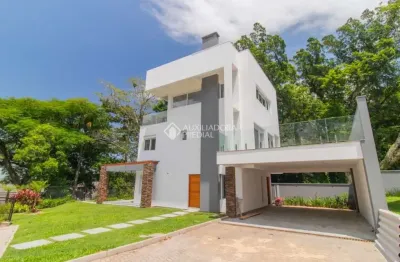 Casa em condomínio fechado com 3 quartos para alugar na avenida coronel marcos, 1239, pedra redonda, porto alegre, 335 m2 por r$ 29.900