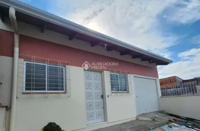 Casa com 3 quartos para alugar na Rua Quarenta e Três, 53, Jardim Algarve, Alvorada, 123 m2 por R$ 2.500