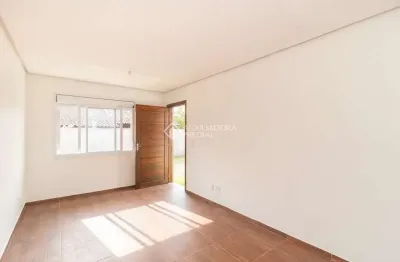 Casa em condomínio fechado com 2 quartos para alugar na rua santa mônica, 404, ponta grossa, porto alegre, 60 m2 por r$ 1.200