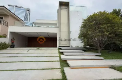 Residência contemporânea com 4 suítes, escritório e área gourmet integrada em condomínio de alphaville