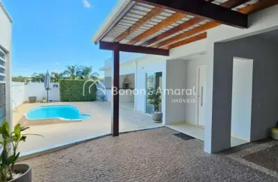 Casa térrea no condomínio palmeiras sul - 295m², 4 suítes, salas integradas, escritório, espaço gourmet e piscina.