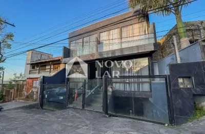 Casa com 3 quartos à venda na Rua Barão de Bagé, 721, Vila Jardim, Porto Alegre por R$ 1.090.000