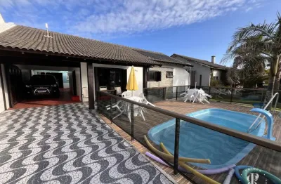 Casa térrea 4 dormitórios, sendo 3 suítes, 178m2 próximo ao  Mar em Imbé RS.