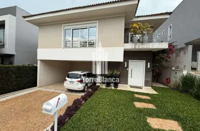 Casa mobiliada para locação ou venda, 3 suítes, 4 banheiros, 2 vagas cobertas, 335m², condomínio la