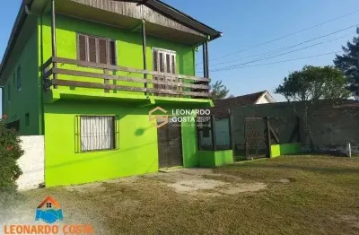 Prédio com 3 apartamentos e 1 sala comercial no centro de balneário pinhal