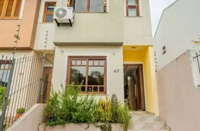 Casa com 3 quartos à venda na Rua Ilari Arlindo Basei, 62, Guarujá, Porto Alegre