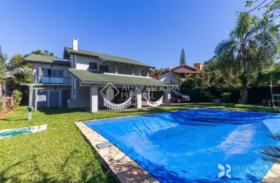 Casa em condomínio fechado com 3 quartos à venda na avenida firmino octávio bimbi, 255, cavalhada, porto alegre, 400 m2 por r$ 1.999.000