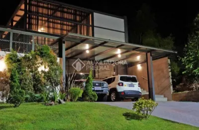 Casa em condomínio fechado com 3 quartos à venda na avenida senador salgado filho, 8500, jardim krahe, viamão, 357 m2 por r$ 1.200.000