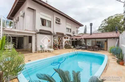 Casa em condomínio fechado com 3 quartos à venda na avenida montreal, 356, jardim lindóia, porto alegre, 380 m2 por r$ 1.690.000