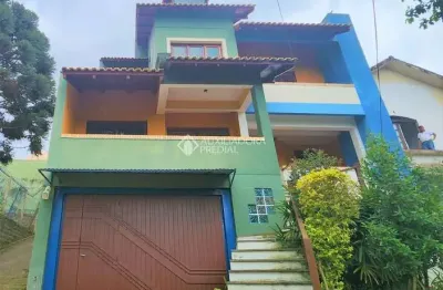 Casa com 3 quartos à venda na rua theonila carvalho da motta, 80, parque santa fé, porto alegre, 438 m2 por r$ 1.150.000