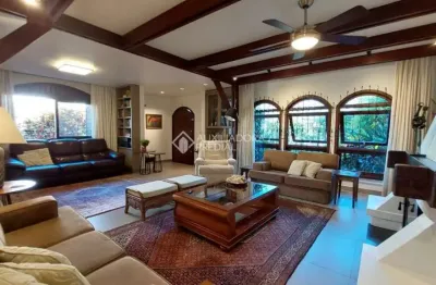Casa em condomínio fechado com 3 quartos à venda na rua inhanduí, 252, cristal, porto alegre, 309 m2 por r$ 1.600.000
