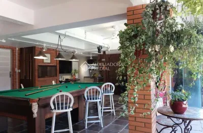 Casa em condomínio fechado com 3 quartos à venda na rua inhanduí, 252, cristal, porto alegre, 309 m2 por r$ 1.600.000