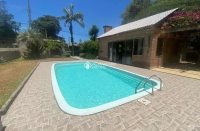 Casa com 3 quartos à venda na maura­cio lessa, 295, flórida, guaíba, 300 m2 por r$ 970.000