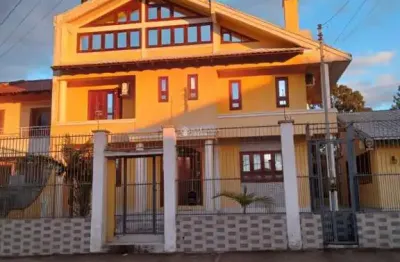 Casa com 4 quartos à venda na avenida vasco alves pereira, 6, morada da colina, guaíba, 106 m2 por r$ 980.000