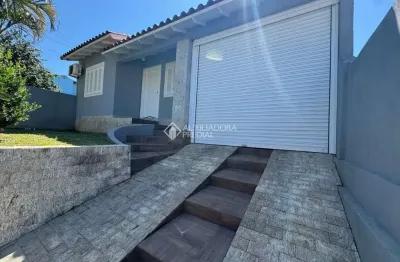 Casa em condomínio fechado com 3 quartos à venda na Rua Toríbio Cambará, 254, Jardim dos Lagos, Guaíba, 145 m2 por R$ 430.000