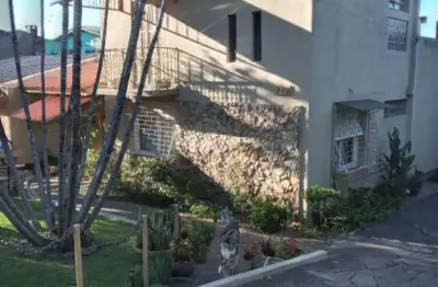 Casa com 4 quartos à venda na avenida joracy camargo, 289, santa tereza, porto alegre, 187 m2 por r$ 1.150.000
