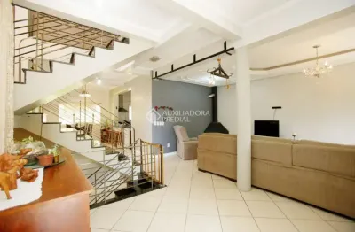 Casa com 5 quartos à venda na rua isidoro tressi, 507, jardim botânico, porto alegre, 379 m2 por r$ 1.550.000