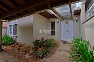 Casa em condomínio fechado com 3 quartos à venda na avenida juca batista, 8000, belém novo, porto alegre, 294 m2 por r$ 1.685.000