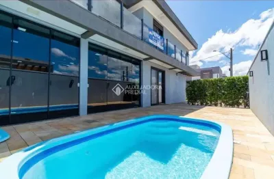 Casa em condomínio fechado com 3 quartos à venda na das cerejeiras, 43, parque da matriz, gravataí, 257 m2 por r$ 1.089.000