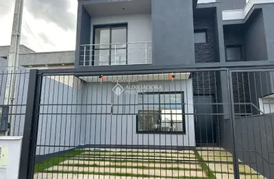 Casa com 3 quartos à venda na rubem fonseca vargas, 116, dom feliciano, gravataí, 100 m2 por r$ 589.900