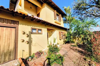 Casa em condomínio fechado com 5 quartos à venda na rua osvaldo optiz, 533, estância velha, canoas, 258 m2 por r$ 902.500