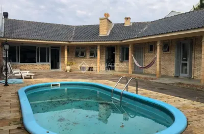 Casa em condomínio fechado com 5 quartos à venda na rua bagé, 623, niterói, canoas, 235 m2 por r$ 1.250.000